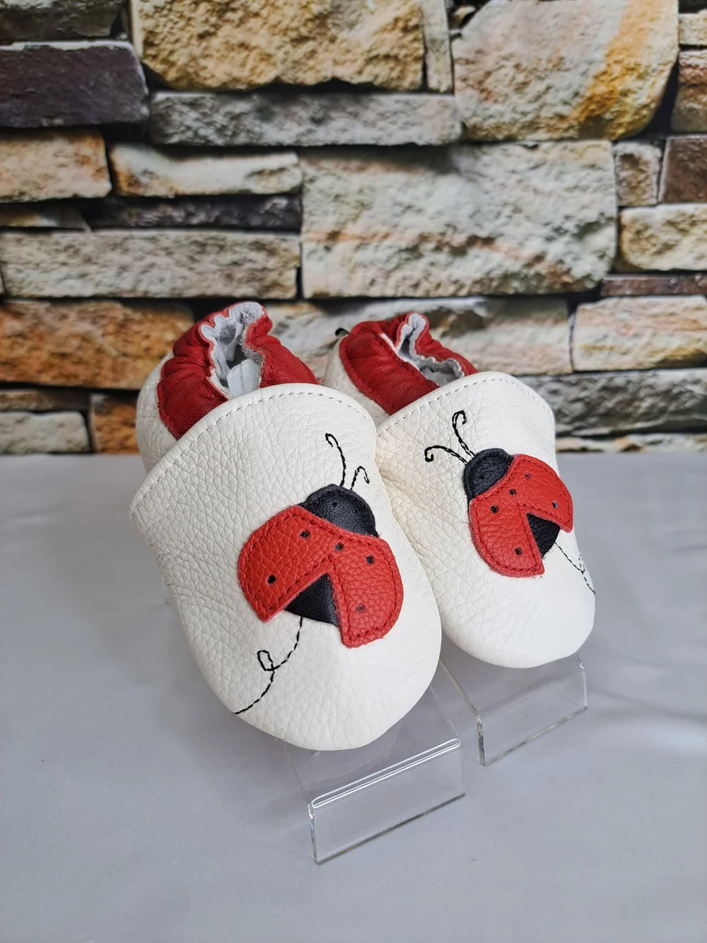 Baby White Leather Slip-On Shoes with Red Ladybug Detail